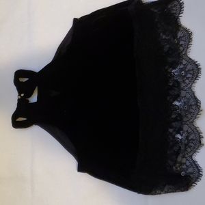 It’s a black velvet crop top from Gypsies & Moondust